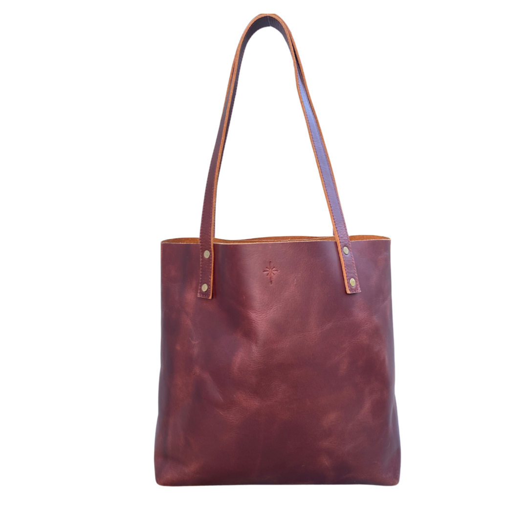 Brown leather tote bag with transparent background, two straps